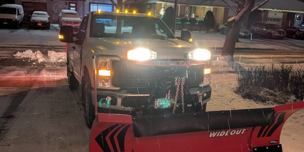 Snow removal from a driveway done by Framptons Property Services Snow removal program.